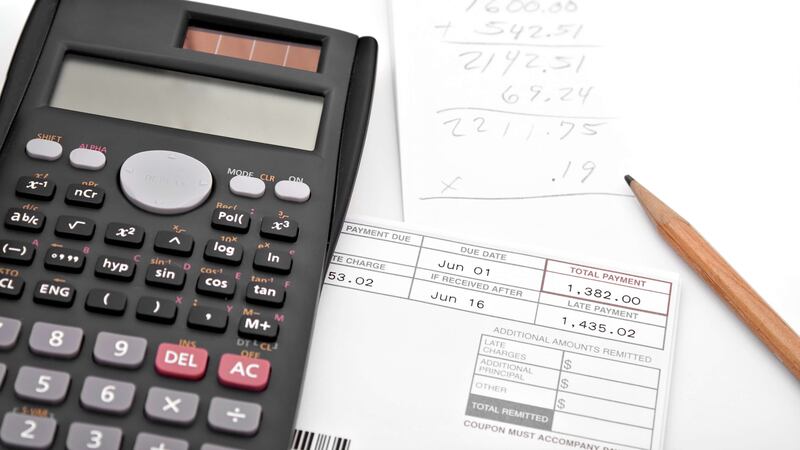 Calculator and pencil with papers.