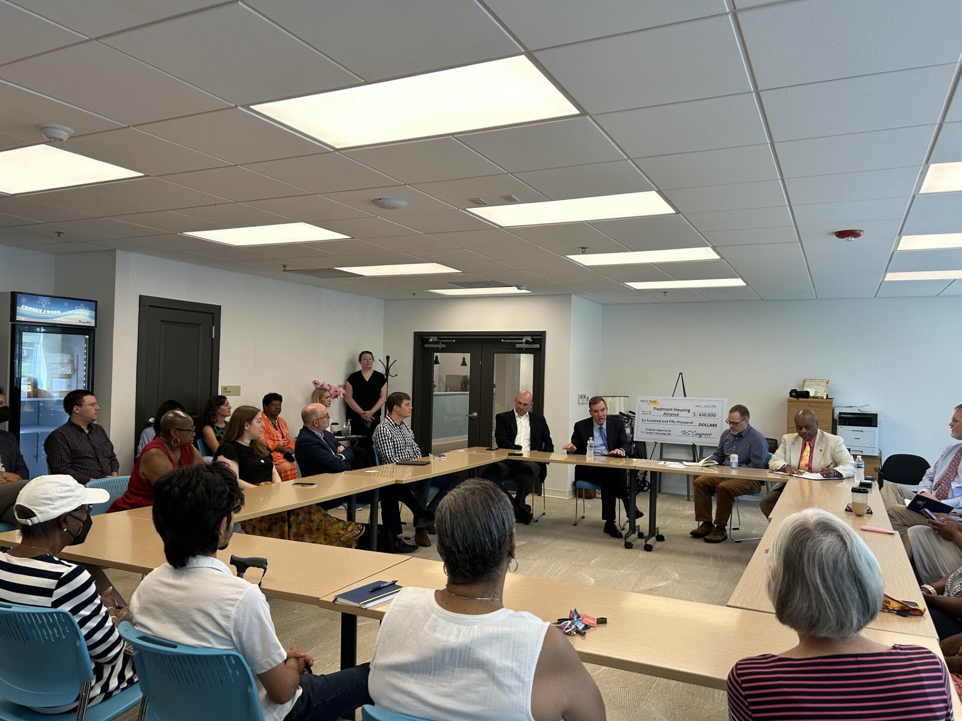 Senator Warner hand-delivers housing check to Piedmont Housing Alliance - Vimarsana News
