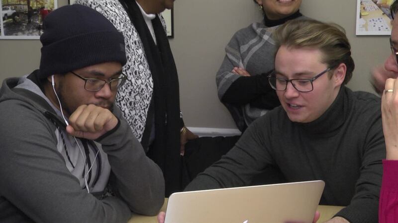 People with the UVA Equity Center helping those in the Southwood neighborhood with the college...