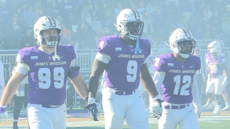 From left: James Carpenter, Jamree Kromah, and Cheese Sarratt walk to midfield for the coin...