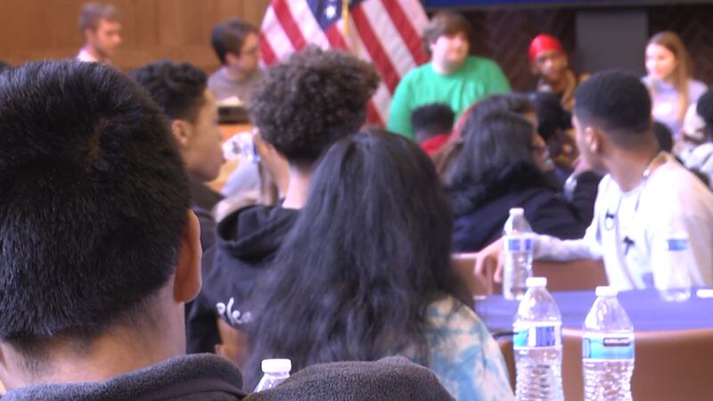 Charlottesville High School students watch a presentation from Batten School students.