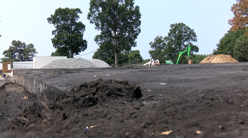 Volunteers work to clear debris and rubble after a fire at the Metro Richmond Zoo.