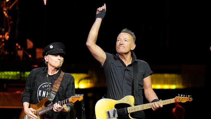 Singer Bruce Springsteen, right, and E Street Band member Nils Lofgren perform during their...